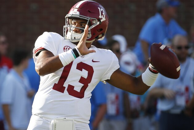 Alabama quarterback Tua Tagovailoa (13) works on passing drills during warmups for their NCAA college football game against Mississippi on Saturday, Sept. 15, 2018, in Oxford, Miss. Alabama won 62-7.(AP Photo/Rogelio V. Solis)