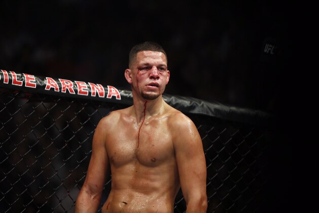Conor McGregor fights Nate Diaz during their welterweight mixed martial arts bout at UFC 202 on Saturday, Aug. 20, 2016, in Las Vegas. McGregor won by split decision. (AP Photo/Isaac Brekken)