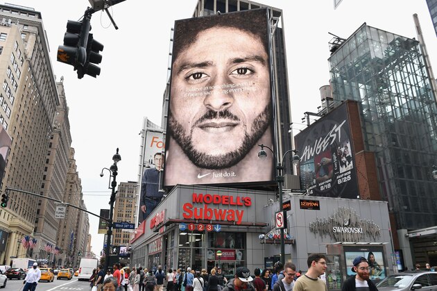 TOPSHOT - A Nike Ad featuring American football quarterback  Colin Kaepernick is on diplay September 8, 2018 in New York City. - Nike's new ad campaign featuring Kaepernick, the American football player turned activist against police violence, takes a strong stance on a divisive issue which could score points with millennials but risks alienating conservative customers. The ads prompted immediate calls for Nike boycotts over Kaepernick, who has been castigated by US President Donald Trump and other conservatives over his kneeling protests during the playing of the US national anthem. (Photo by Angela Weiss / AFP)        (Photo credit should read ANGELA WEISS/AFP/Getty Images)