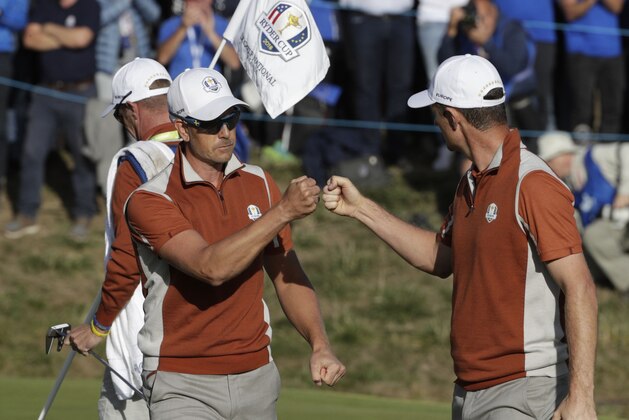 Europe's Swedish golfer Henrick Stenson (L) and Europe's English golfer Justin Rose react  during their foursomes match on the second day of the 42nd Ryder Cup at Le Golf National Course at Saint-Quentin-en-Yvelines, south-west of Paris, on September 29, 2018. (Photo by Geoffroy VAN DER HASSELT / AFP)        (Photo credit should read GEOFFROY VAN DER HASSELT/AFP/Getty Images)