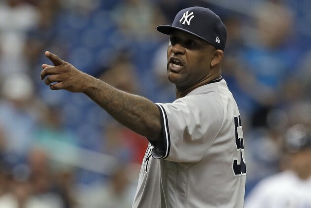 New York Yankees' CC Sabathia points at the Tampa Bay Rays dugout after he was ejected for hitting Tampa Bay Rays' Jesus Sucre with a pitch during the sixth inning of a baseball game Thursday, Sept. 27, 2018, in St. Petersburg, Fla. (AP Photo/Chris O'Meara)
