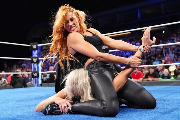 Becky Lynch attacking Charlotte Flair on SmackDown.