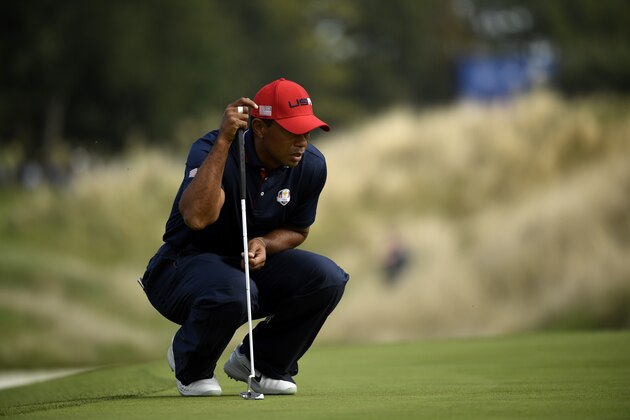 US golfer Tiger Woods lines up a putt on the third day of the 42nd Ryder Cup at Le Golf National Course at Saint-Quentin-en-Yvelines, south-west of Paris, on September 30, 2018. (Photo by Eric FEFERBERG / AFP)        (Photo credit should read ERIC FEFERBERG/AFP/Getty Images)