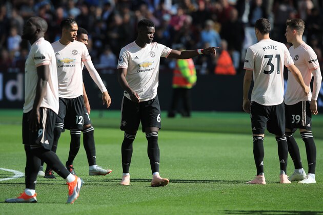 LONDON, ENGLAND - SEPTEMBER 29: Paul Pogba of Manchester United among team mates during the Premier League match between West Ham United and Manchester United at London Stadium on September 29, 2018 in London, United Kingdom. (Photo by Marc Atkins/Getty Images)