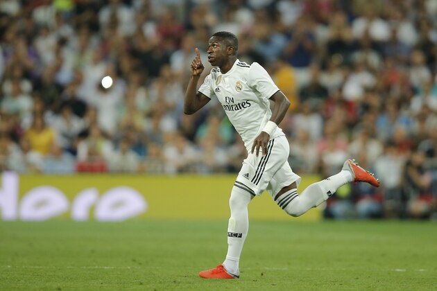 Real Madrid's Vinicius Junior gestures as he enters the pitch during a Spanish La Liga soccer match between Real Madrid and Atletico Madrid at the Santiago Bernabeu stadium in Madrid, Spain, Saturday, Sept. 29, 2018. The match ended in a 0-0 draw. (AP Photo/Paul White)