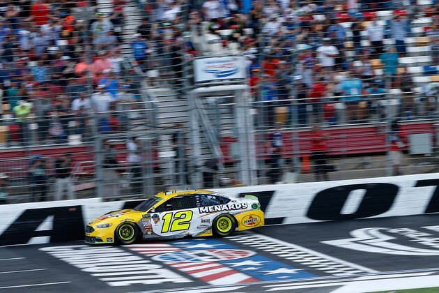 CHARLOTTE, NC - SEPTEMBER 30:  Ryan Blaney, driver of the #12 Menards/Pennzoil Ford, crosses the finish line to win the Monster Energy NASCAR Cup Series Bank of America Roval 400 at Charlotte Motor Speedway on September 30, 2018 in Charlotte, North Carolina.  (Photo by Brian Lawdermilk/Getty Images)