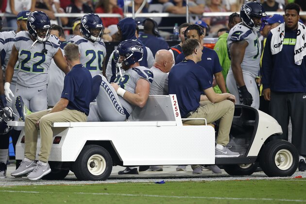 Seattle Seahawks tight end Will Dissly (88) is carted off the field after an injury against the Arizona Cardinals during the first half of an NFL football game, Sunday, Sept. 30, 2018, in Glendale, Ariz. (AP Photo/Ross D. Franklin)