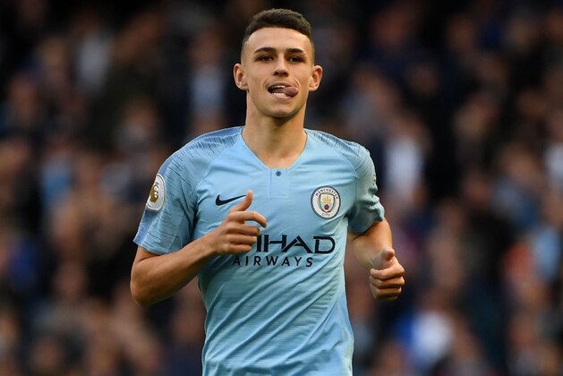 Manchester City's English midfielder Phil Foden is seen in action during the English Premier League football match between Manchester City and Brighton and Hove Albion at the Etihad Stadium in Manchester, north west England, on September 29, 2018. (Photo by Paul ELLIS / AFP) / RESTRICTED TO EDITORIAL USE. No use with unauthorized audio, video, data, fixture lists, club/league logos or 'live' services. Online in-match use limited to 120 images. An additional 40 images may be used in extra time. No video emulation. Social media in-match use limited to 120 images. An additional 40 images may be used in extra time. No use in betting publications, games or single club/league/player publications. / (Photo credit should read PAUL ELLIS/AFP/Getty Images) Manchester City's English midfielder Phil Foden is seen in action during the English Premier League football match between Manchester City and Brighton and Hove Albion at the Etihad Stadium in Manchester, north west England, on September 29, 2018. (Photo by Paul ELLIS / AFP) / RESTRICTED TO EDITORIAL USE. No use with unauthorized audio, video, data, fixture lists, club/league logos or 'live' services. Online in-match use limited to 120 images. An additional 40 images may be used in extra time. No video emulation. Social media in-match use limited to 120 images. An additional 40 images may be used in extra time. No use in betting publications, games or single club/league/player publications. / (Photo credit should read PAUL ELLIS/AFP/Getty Images)