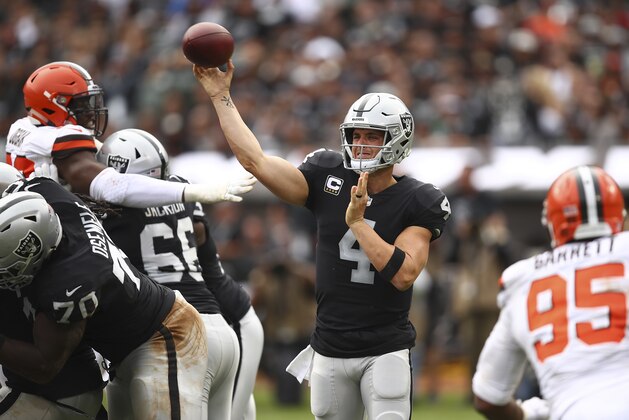 Oakland Raiders quarterback Derek Carr (4) passes against the Cleveland Browns during the second half of an NFL football game in Oakland, Calif., Sunday, Sept. 30, 2018. (AP Photo/Ben Margot)