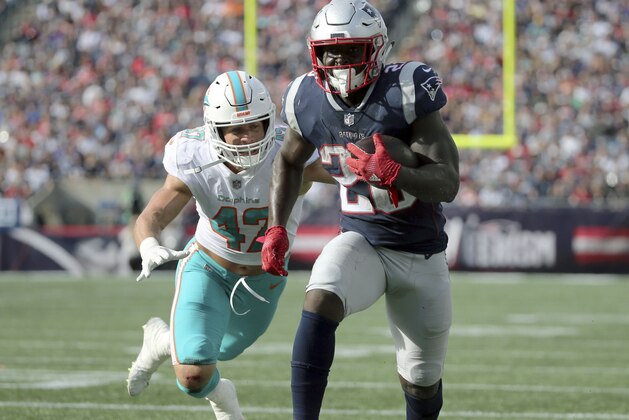 New England Patriots running back Sony Michel (26) runs away from Miami Dolphins linebacker Kiko Alonso (47) for a touchdown during the second half of an NFL football game, Sunday, Sept. 30, 2018, in Foxborough, Mass. (AP Photo/Elise Amendola)