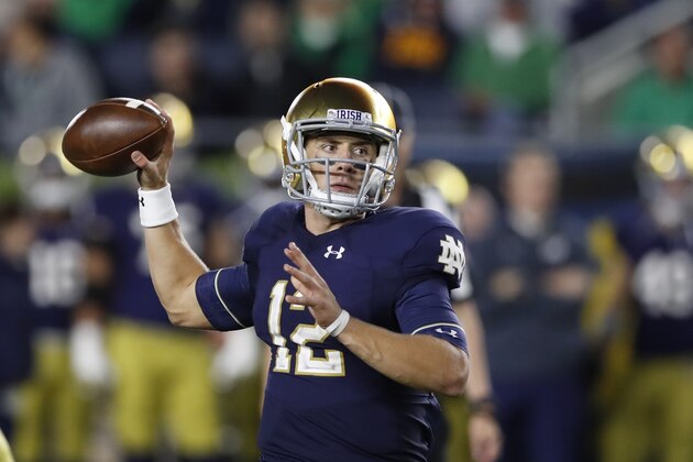 Notre Dame quarterback Ian Book throws during the second half of an NCAA college football game, Saturday, Sept. 29, 2018, in South Bend, Ind. (AP Photo/Carlos Osorio)