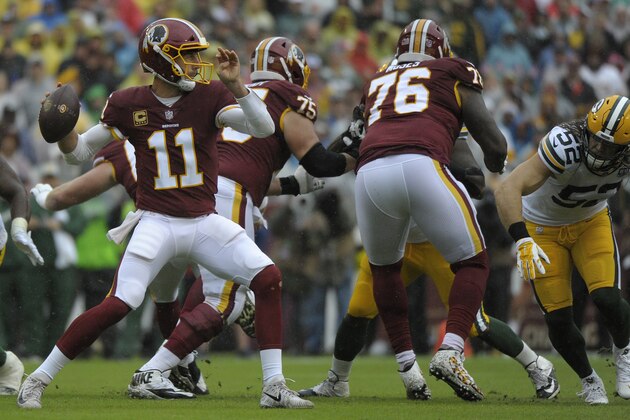 Washington Redskins quarterback Alex Smith (11) passes during an NFL football game against the Green Bay Packers, Sunday, Sept. 23, 2018, in Landover, Md. (AP Photo/Mark Tenally)