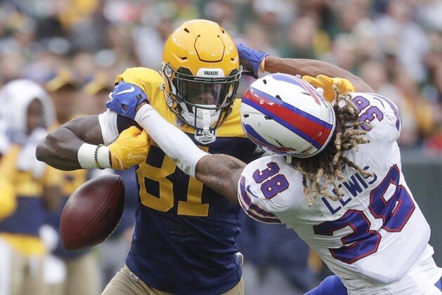 Green Bay Packers' Geronimo Allison drops the ball as he is hit by Buffalo Bills' Ryan Lewis during the first half of an NFL football game Sunday, Sept. 30, 2018, in Green Bay, Wis. The ball went out of bounds. (AP Photo/Morry Gash)