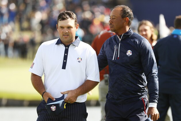 PARIS, FRANCE - SEPTEMBER 29:  Tiger Woods of the United States consolls Patrick Reed of the United States following defeat during the morning fourball matches of the 2018 Ryder Cup at Le Golf National on September 29, 2018 in Paris, France.  (Photo by Jamie Squire/Getty Images)