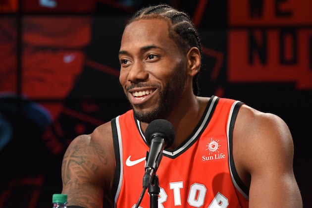 TORONTO, ON - SEPTEMBER 24: Kawhi Leonard #2 of the Toronto Raptors smiles at a press conference after media day on September 24, 2018 at the Air Canada Centre in Toronto, Ontario, Canada. NOTE TO USER: User expressly acknowledges and agrees that, by downloading and or using this photograph, User is consenting to the terms and conditions of the Getty Images License Agreement. Mandatory Copyright Notice: Copyright 2018 NBAE (Photo by Ron Turenne/NBAE via Getty Images) TORONTO, ON - SEPTEMBER 24: Kawhi Leonard #2 of the Toronto Raptors smiles at a press conference after media day on September 24, 2018 at the Air Canada Centre in Toronto, Ontario, Canada. NOTE TO USER: User expressly acknowledges and agrees that, by downloading and or using this photograph, User is consenting to the terms and conditions of the Getty Images License Agreement. Mandatory Copyright Notice: Copyright 2018 NBAE (Photo by Ron Turenne/NBAE via Getty Images)