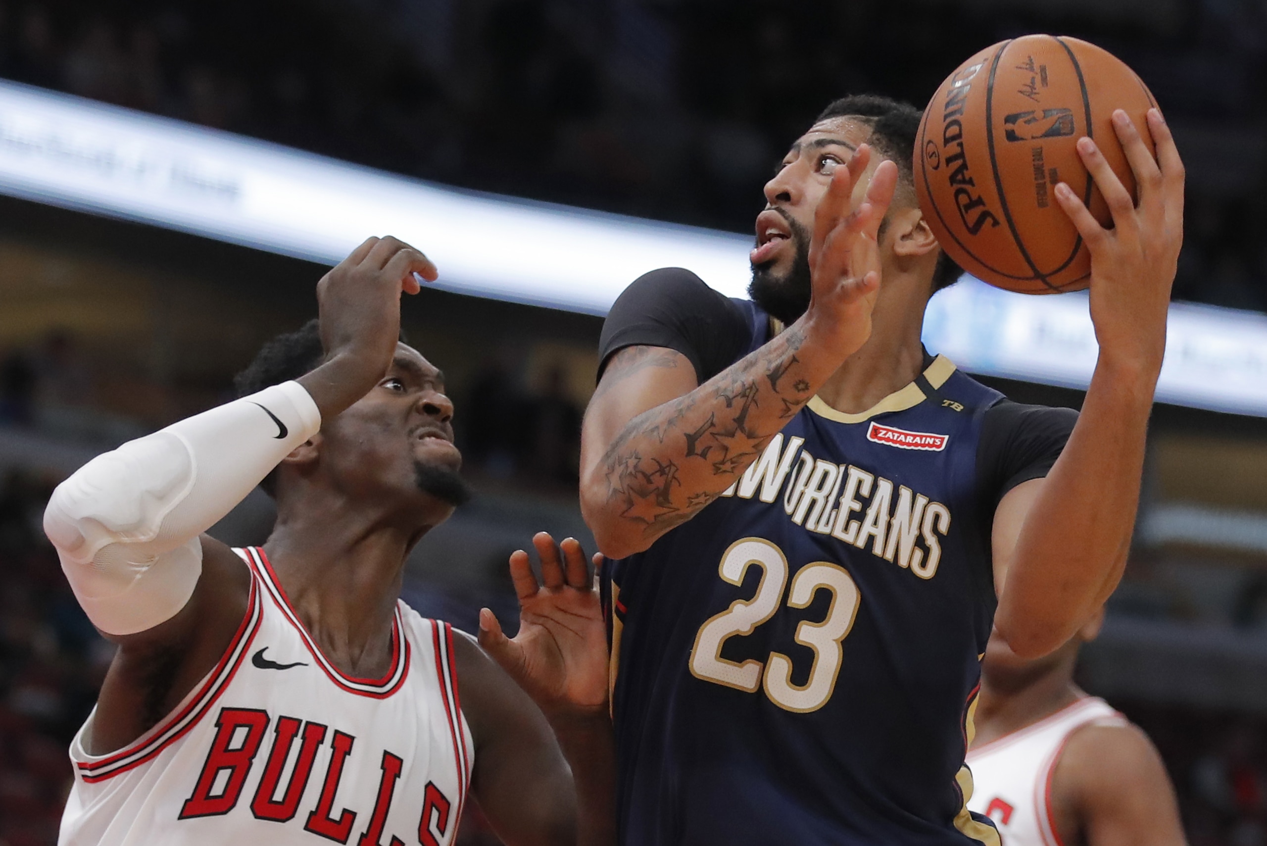 New Orleans Pelicans' Anthony Davis, right, goes to the basket against Chicago Bulls' Bobby Portis during the first half of a preseason NBA basketball game Sunday, Sept. 30, 2018, in Chicago. (AP Photo/Jim Young) New Orleans Pelicans' Anthony Davis, right, goes to the basket against Chicago Bulls' Bobby Portis during the first half of a preseason NBA basketball game Sunday, Sept. 30, 2018, in Chicago. (AP Photo/Jim Young)