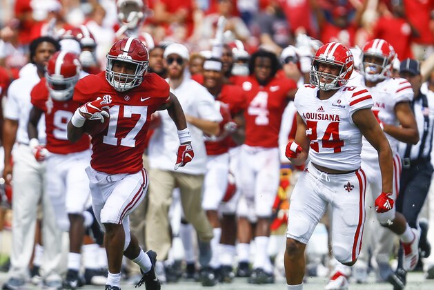 Alabama wide receiver Jaylen Waddle (17) catches pass and out runs Louisiana-Lafayette defensive back Bralen Trahan (24) for a touchdown during the second half of an NCAA college football game, Saturday, Sept. 29, 2018, in Tuscaloosa, Ala. Alabama won 56-14. (AP Photo/Butch Dill)