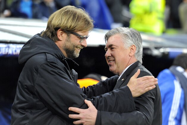 Dortmund's head coach Juergen Klopp (L) greets Real Madrid's Italian coach Carlo Ancelotti before the UEFA Champions League quarterfinal first leg football match Real Madrid FC vs Borussia Dortmund at the Santiago Bernabeu stadium in Madrid on April 2, 2014.   AFP PHOTO/ GERARD JULIEN        (Photo credit should read GERARD JULIEN/AFP/Getty Images)