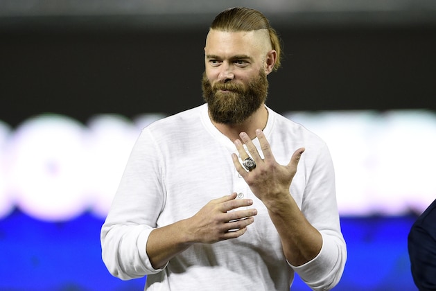 Former Washington Nationals player Jayson Werth displays a ring given to him during a Ring of Honor ceremony before the second baseball game of a doubleheader against the Chicago Cubs, Saturday, Sept. 8, 2018, in Washington. (AP Photo/Nick Wass)
