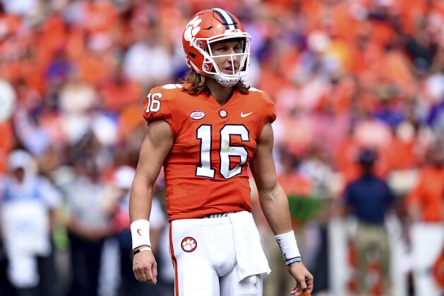 Clemson quarterback Trevor Lawrence looks to the sidelines during the first half of an NCAA college football game against Syracuse Saturday, Sept. 29, 2018, in Clemson, S.C. Clemson won 27-23. (AP Photo/Richard Shiro)