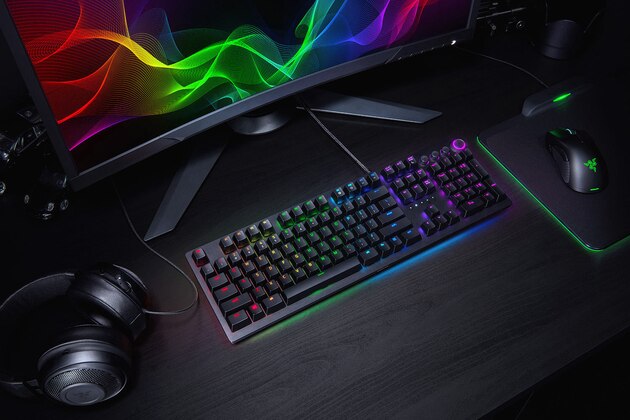 The Razer Huntsman Elite mechanical keyboard and other Razer gear in all their technicolor glory.