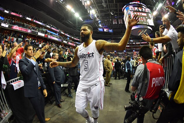WASHINGTON, DC -  APRIL 22: Markieff Morris #5 of the Washington Wizards exchanges high fives with fans as he exits the arena after Game Four of Round One of the 2018 NBA Playoffs against the Toronto Raptors on April 22, 2018 at Capital One Arena in Washington, DC. NOTE TO USER: User expressly acknowledges and agrees that, by downloading and or using this Photograph, user is consenting to the terms and conditions of the Getty Images License Agreement. Mandatory Copyright Notice: Copyright 2018 NBAE (Photo by Jesse D. Garrabrant/NBAE via Getty Images)