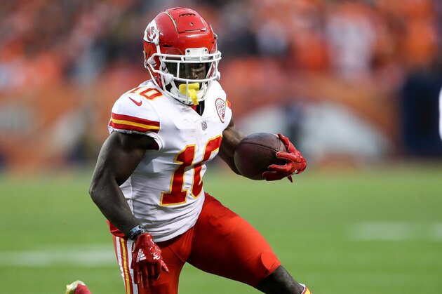 DENVER, CO - OCTOBER 1:  Wide receiver Tyreek Hill #10 of the Kansas City Chiefs runs after a catch against the Denver Broncos in the first quarter at Broncos Stadium at Mile High on October 1, 2018 in Denver, Colorado. (Photo by Matthew Stockman/Getty Images)