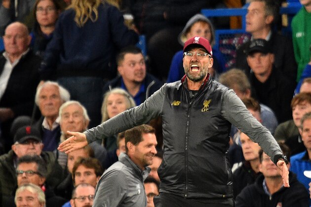 Liverpool's German manager Jurgen Klopp gestures during the English Premier League football match between Chelsea and Liverpool at Stamford Bridge in London on September 29, 2018. (Photo by Glyn KIRK / AFP) / RESTRICTED TO EDITORIAL USE. No use with unauthorized audio, video, data, fixture lists, club/league logos or 'live' services. Online in-match use limited to 120 images. An additional 40 images may be used in extra time. No video emulation. Social media in-match use limited to 120 images. An additional 40 images may be used in extra time. No use in betting publications, games or single club/league/player publications. /         (Photo credit should read GLYN KIRK/AFP/Getty Images)