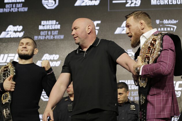 Conor McGregor, right, and Khabib Nurmagomedov, left, are separated by UFC president Dana White during a news conference in New York, Thursday, Sept. 20, 2018. McGregor is returning to UFC after a two-year absence. He fights undefeated Nurmagomedov on Oct. 6. (AP Photo/Seth Wenig)