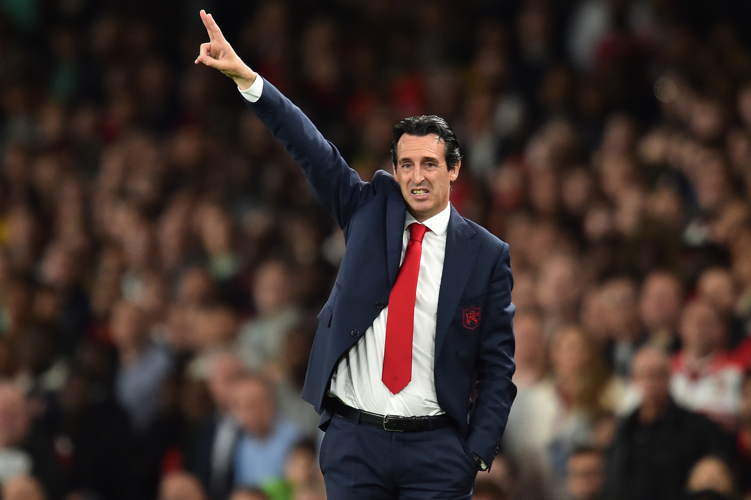 Arsenal's Spanish head coach Unai Emery shouts instructions to his players from the touchline during the English League Cup third round football match between Arsenal and Brentford at the Emirates Stadium in London on September 26, 2018. (Photo by Glyn KIRK / AFP) / RESTRICTED TO EDITORIAL USE. No use with unauthorized audio, video, data, fixture lists, club/league logos or 'live' services. Online in-match use limited to 120 images. An additional 40 images may be used in extra time. No video emulation. Social media in-match use limited to 120 images. An additional 40 images may be used in extra time. No use in betting publications, games or single club/league/player publications. /         (Photo credit should read GLYN KIRK/AFP/Getty Images)