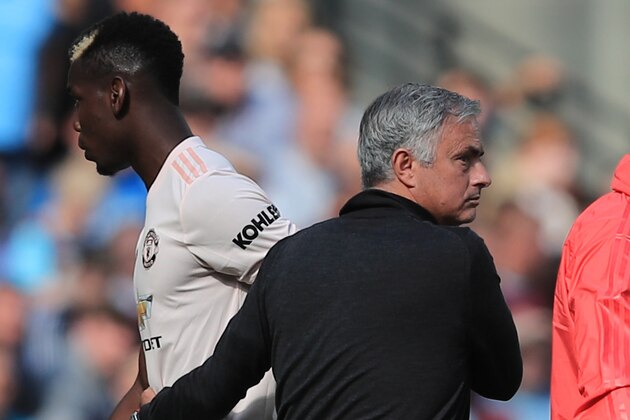 LONDON, ENGLAND - SEPTEMBER 29: Paul Pogba of Manchester United with Jose Mourinho manager of Manchester United as he is substituted during the Premier League match between West Ham United and Manchester United at London Stadium on September 29, 2018 in London, United Kingdom. (Photo by Marc Atkins/Getty Images)