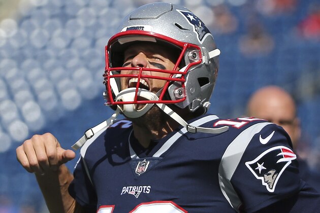 New England Patriots quarterback Tom Brady fires up the crowd as he takes the field before an NFL football game against the Miami Dolphins at Gillette Stadium, Sunday, Sept. 30, 2018, in Foxborough, Mass. (AP Photo/Elise Amendola)
