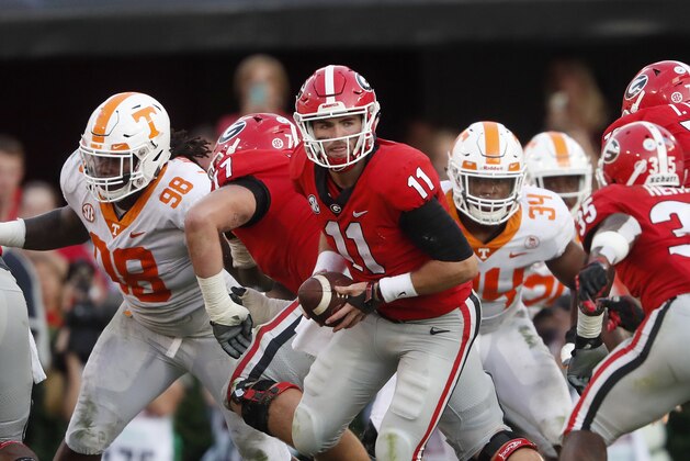 Georgia quarterback Jake Fromm (11) hands off during the second half of an NCAA college football game gains Tennessee Saturday, Sept. 29, 2018, in Athens, Ga. Georgia won 38-12. (AP Photo/John Bazemore)
