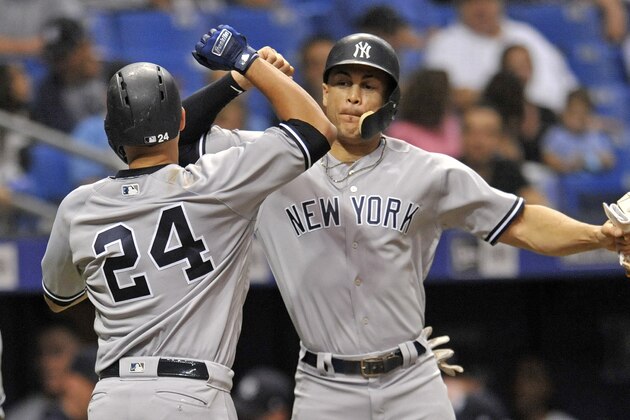 New York Yankees' Gary Sanchez (24) and Giancarlo Stanton celebrate during a baseball game against the Tampa Bay Rays Tuesday, Sept. 25, 2018, in St. Petersburg, Fla. (AP Photo/Steve Nesius)