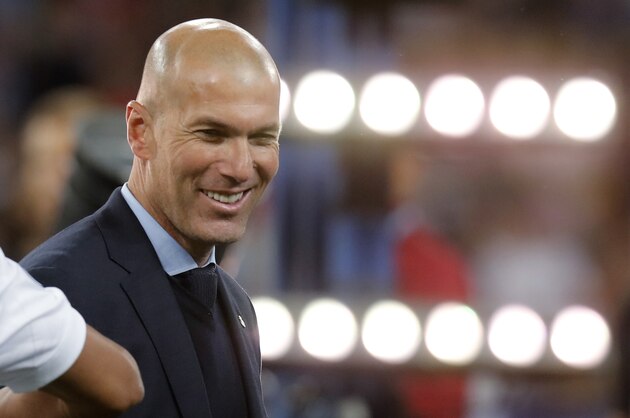 FILE - In this May 26, 2018 photo Real Madrid coach Zinedine Zidane smiles after winning the Champions League Final soccer match between Real Madrid and Liverpool at the Olimpiyskiy Stadium in Kiev. (AP Photo/Efrem Lukatsky, file)