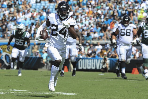 JACKSONVILLE, FL - SEPTEMBER 30: T.J. Yeldon #24 of the Jacksonville Jaguars runs for a touchdown during the first half against the New York Jets at TIAA Bank Field on September 30, 2018 in Jacksonville, Florida.  (Photo by Sam Greenwood/Getty Images)
