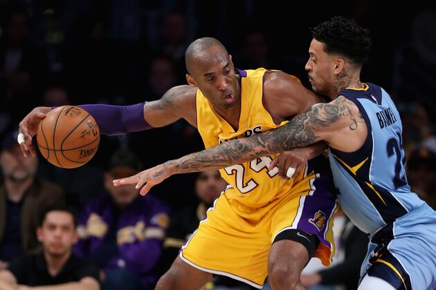 LOS ANGELES, CA - MARCH 22:  Kobe Bryant #24 of the Los Angeles Lakers dribbles around Matt Barnes #22 of the Memphis Grizzlies  during the second half of a game at Staples Center on March 22, 2016 in Los Angeles, California.  (Photo by Sean M. Haffey/Getty Images)