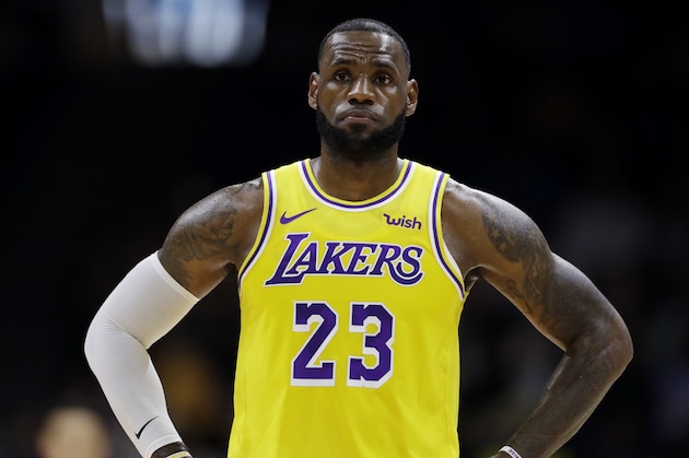 Los Angeles Lakers forward LeBron James looks on during the first half of an NBA preseason basketball game against the Denver Nuggets Sunday, Sept. 30, 2018, in San Diego. (AP Photo/Gregory Bull)