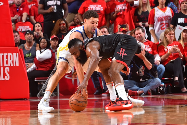 HOUSTON, TX - MAY 24: Klay Thompson #11 of the Golden State Warriors defends James Harden #13 of the Houston Rockets during Game Five of the Western Conference Finals of the 2018 NBA Playoffs on May 24, 2018 at the Toyota Center in Houston, Texas. NOTE TO USER: User expressly acknowledges and agrees that, by downloading and or using this photograph, User is consenting to the terms and conditions of the Getty Images License Agreement. Mandatory Copyright Notice: Copyright 2018 NBAE (Photo by Jesse D. Garrabrant/NBAE via Getty Images)