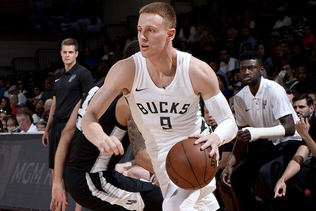 LAS VEGAS, NV - JULY 12:  Donte DiVincenzo #9 of the Milwaukee Bucks handles the ball against the San Antonio Spurs during the 2018 Las Vegas Summer League on July 12, 2018 at the Cox Pavilion in Las Vegas, Nevada. NOTE TO USER: User expressly acknowledges and agrees that, by downloading and/or using this photograph, user is consenting to the terms and conditions of the Getty Images License Agreement. Mandatory Copyright Notice: Copyright 2018 NBAE (Photo by David Dow/NBAE via Getty Images)