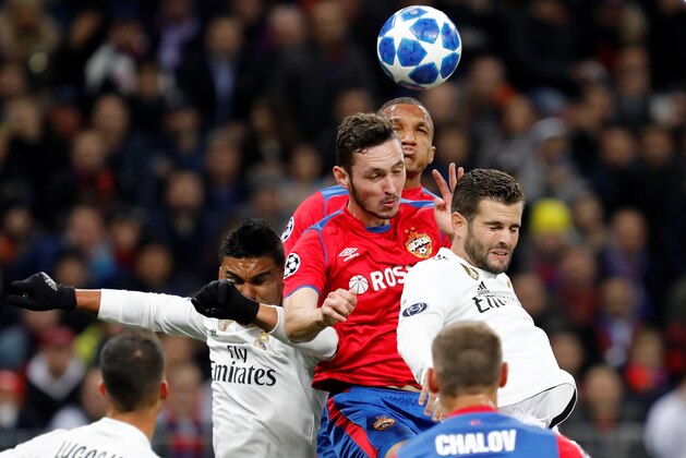 MOSCOW, RUSSIA - OCTOBER 02: Nikita Chernov (C) and Rodrigo Becao of CSKA Moscow vie for a header with Casemiro (L) and Nacho (R) of Real Madrid during the Group G match of the UEFA Champions League between CSKA Moscow and Real Madrid at Luzhniki Stadium on October 2, 2018 in Moscow, Russia. (Photo by MB Media/Getty Images)