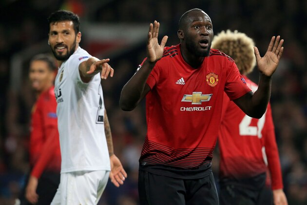Manchester United's Belgian striker Romelu Lukaku (R) reacts after a challenge on Valencia's Spanish defender Jose Luis Gaya Pena during the Champions League group H football match between Manchester United and Valencia at Old Trafford in Manchester, north west England, on October 2, 2018. (Photo by Lindsey PARNABY / AFP)        (Photo credit should read LINDSEY PARNABY/AFP/Getty Images)