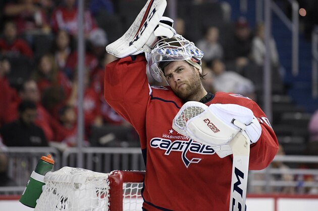 Washington Capitals goaltender Braden Holtby (70) looks on during the first period of an NHL preseason hockey game against the St. Louis Blues, Sunday, Sept. 30, 2018, in Washington. (AP Photo/Nick Wass)