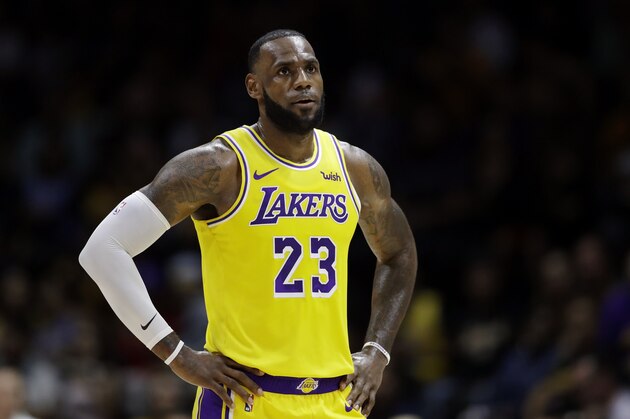 Los Angeles Lakers forward LeBron James looks on during the first half of an NBA preseason basketball game against the Denver Nuggets Sunday, Sept. 30, 2018, in San Diego. (AP Photo/Gregory Bull)