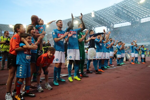 Napoli's players greet fans at the end of the Italian Serie A football match SSC Napoli vs FC Crotone on May 20, 2018 at the San Paolo Stadium. (Photo by CARLO HERMANN / AFP)        (Photo credit should read CARLO HERMANN/AFP/Getty Images)