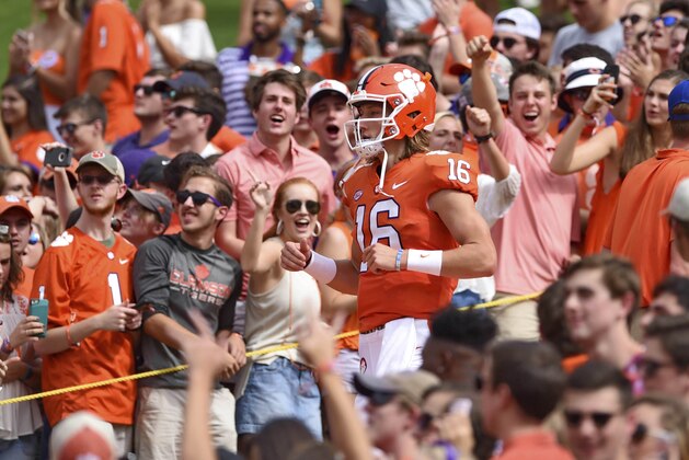 Clemson quarterback Trevor Lawrence runs down