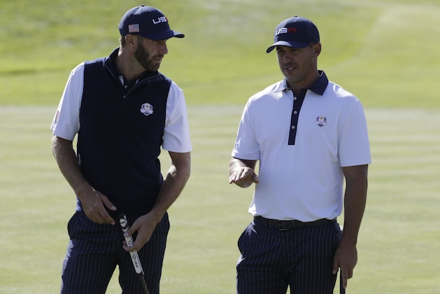 US golfer Dustin Johnson (L) and US golfer Brooks Koepka speak  during their foursomes match on the second day of the 42nd Ryder Cup at Le Golf National Course at Saint-Quentin-en-Yvelines, south-west of Paris, on September 29, 2018. (Photo by Geoffroy VAN DER HASSELT / AFP)        (Photo credit should read GEOFFROY VAN DER HASSELT/AFP/Getty Images)