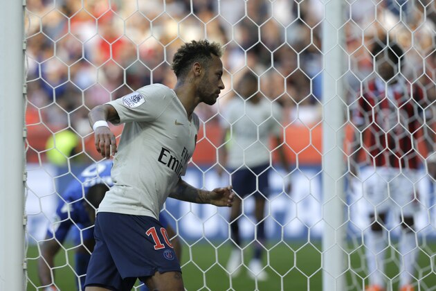 Paris Saint Germain's Neymar, celebrates after scoring his side's second goal, during the League One soccer match between Nice and Paris Saint-Germain at the Allianz Riviera stadium in Nice, southern France, Saturday, Sept. 29, 2018. (AP Photo/Claude Paris)
