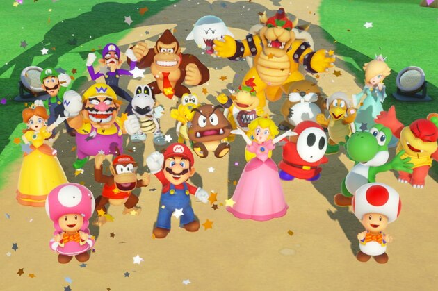 In this Thursday, June 14, 2018, people play Nintendo games at the 24th Electronic Expo, or E3 2018 in Los Angeles. (AP Photo/Damian Dovarganes)