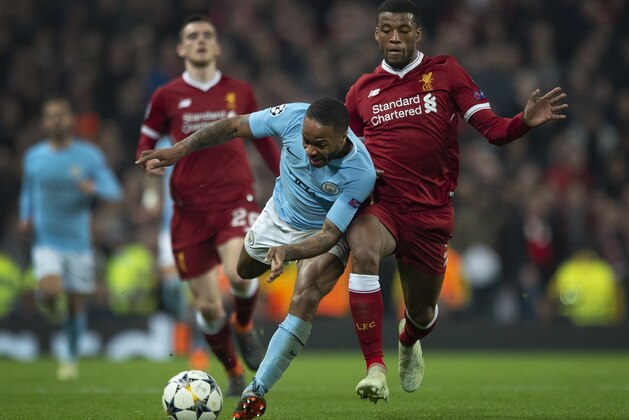 MANCHESTER, ENGLAND - APRIL 10: Raheem Sterling of Manchester City and Georginio Wijnaldum of Liverpool in action during the UEFA Champions League quarter final, 2nd leg tie between Manchester City and Liverpool at the Etihad Stadium on April 10, 2018 in Manchester, England. (Photo by Visionhaus#GP/Getty Images)